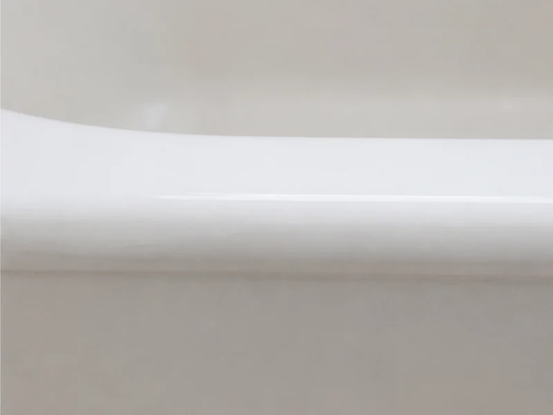 Same tub rim repaired, filled and color-matched to a smooth white finish in a Sundale home, Fremont