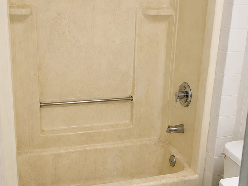 Chalky crazed fiberglass shower stall in a Centerville apartment before refinishing, Fremont